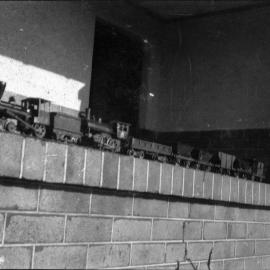 Model locomotives, image 1 of 3, showing a 4-2-0 and a 4-4-0 with goods wagons, unknown date and location, [n.d.]