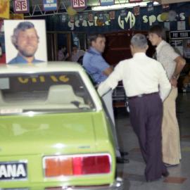Mr Fren speaking to customers in his Holden dealership, Kurri Kurri, NSW, [1970s]