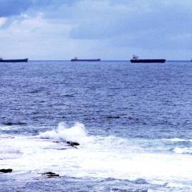 Four bulk carrier ships moored off coast east of Nobby's Head, Newcastle, NSW, 20 May 1974