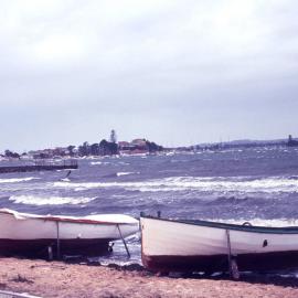 Boats moored at the shoreline on Lake Macquarie, NSW, 24 July 1971