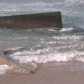Erosion on Stockton Beach revealing army post, January 2006, Stockton, NSW