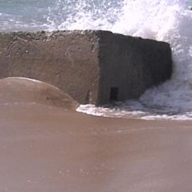 Erosion on Stockton Beach revealing gun emplacement, January 2006, Stockton, NSW
