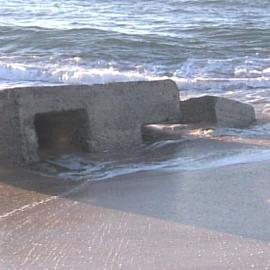 Erosion on Stockton Beach revealing gun emplacement, January 2006, Stockton, NSW