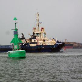 Tugboat "Svitzer Maitland" with bulk carrier, "New Stage" being loaded in background, Newcastle Harbour, NSW, 26 January 2013