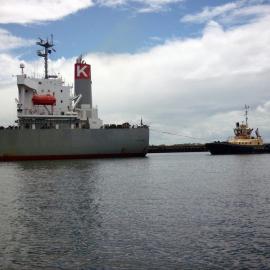 Tugboat "Svitzer Hamilton" with bulk carrier "J P Gunjo", Newcastle Harbour, NSW, 26 January 2013