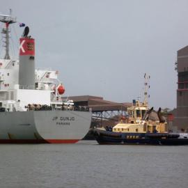 Bulk carrier, "J P Gunjo" with tugboat "Svitzer Hamilton", Newcastle Harbour, NSW, 26 January 2013