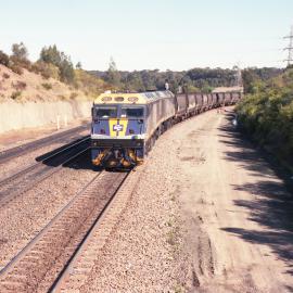 EL55 at the head of unit 48 is seen waiting for a clear road at North Fork near Sandgate. NSW, August 2011