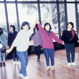 Dancing students holding hands - Medical Communication Unit, the University of Newcastle, Australia