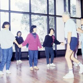Dancing students holding hands - Medical Communication Unit, the University of Newcastle, Australia