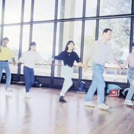 Dancing students holding hands - Medical Communication Unit, the University of Newcastle, Australia