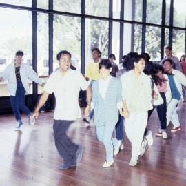 Dancing students holding hands - Medical Communication Unit, the University of Newcastle, Australia
