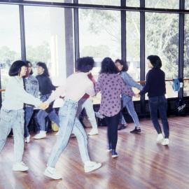 Students holding hands in a circle - Medical Communication Unit, the University of Newcastle, Australia
