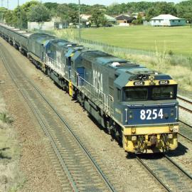8254, 8232 and an 81 class on unit 21 seen on the down coal road at Waratah, NSW, October 2004