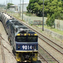 9014 and a classmate seen between Scholey Street and Waratah as they head north to a mine in the Hunter Valley. 
