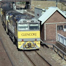 XRN219 and two classmates on a down coal train passing through Waratah, NSW, May 2016