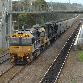 TT102, a 92 class and another TT class hauling unit 24 on the up coal road at Beresfield, NSW, 2 September 2014