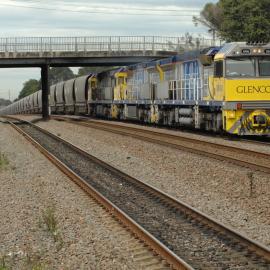 Glencore XRN024 and two classmates on unit 90 head north on the down coal road at Beresfield, NSW, 2 September 2014