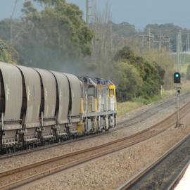 Three XRN locomotives heading north with a Glencore coal train through Beresfield, NSW, 2 September 2014