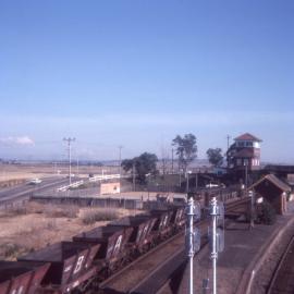 A 48 class hauling a string of private non-air coal hoppers passes through Maitland on its way to East Greta Junction, NSW