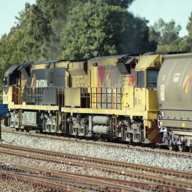 QR National 5001 and Aurizon 5033 pass through Maitland on their way to Kooragang or Port Waratah, NSW, April 2014