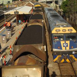 EL56 and a classmate on unit 47 an Austar coal train pass another Austar coal train at Maitland, NSW, 8 April 2017