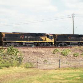 QR National 5008 and 5006 heading north through Maitland, NSW, April 2016