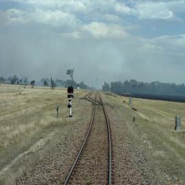 Approaching the home signal at Bulga as a bushfire is set to complicate matters, December 2002