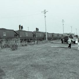 Firemen extinguishing burning coal in NHTF hoppers at Singleton, NSW, September 1986