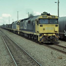 8129 and an 81 class on a down grain train passing through Singleton, NSW, April 2013