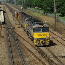Glencore XRN006 and two classmates on unit 91 powering through Singleton as they head north to a mine in the Hunter Valley