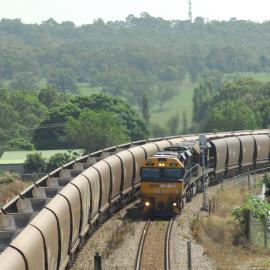 Pacific National TT101 and two classmates on unit 13 approaching Singleton with a heavy coal train, April 2017