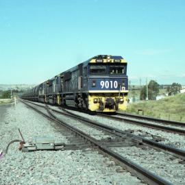 9010, a classmate and an 82 class on unit 6 heading north at Mount Owen Junction, NSW, April 2006