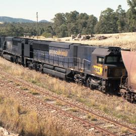 9012, 9016 and a rather grubby 9034 wait for the bin to fill up before loading resumes at Drayton, NSW, August 2013