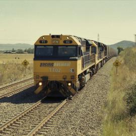TT02, a 92 class and another TT class seen waiting for a cross at Yarrawa, NSW, January 2014