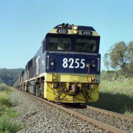 8255 and a classmate on unit 21 wait at the down distand signal for Kerrabee to cross an up train, March 2002