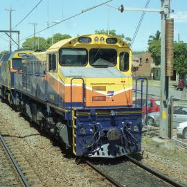 QR 42301 and a 422 class seen passing Broadmeadow, NSW