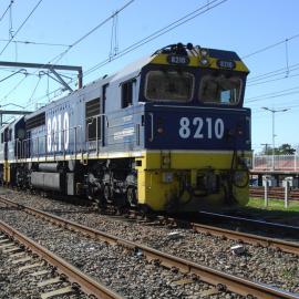 8210 and three classmates amble past Broadmeadow station on the up relief as they head south with an empty rake
