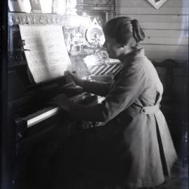 Lady playing the piano, [n.d.]